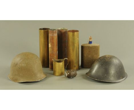 A World War Two US Army helmet, various shell cases, hand grenade, flask.