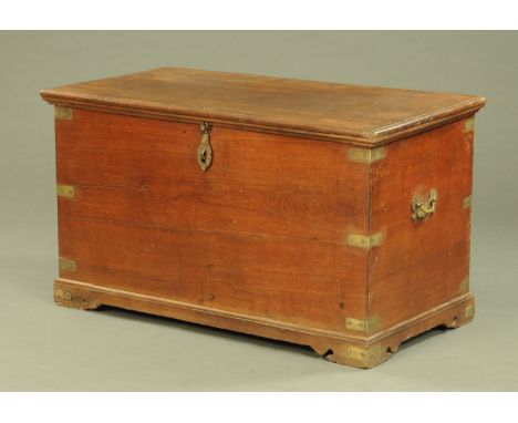 A 19th century brass bound trunk, with hinged top, iron lock mechanism and raised on bracket feet.  Width 118 cm, depth 64 cm