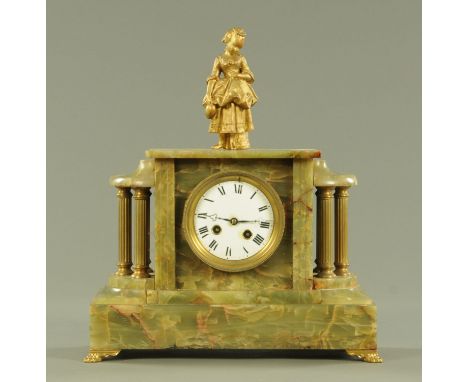 A late 19th century gilt metal and green onyx mantle clock, surmounted by a gilt female above the enamel clock dial flanked b