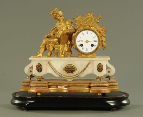 A late 19th century French gilt spelter and alabaster mantle clock, the eight day movement chiming on a bell, the gilt metal 