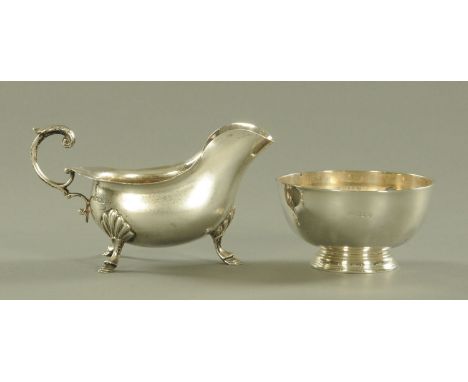 A late Victorian silver sauce boat, Walker &amp; Hall, 1900, and a silver sugar basin, Birmingham 1918, diameter 10 cm, 303 g