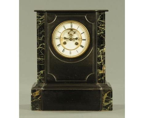 A Victorian polished black slate and verde marble mantle clock, the enamel dial with brocot escapement and with eight day mov