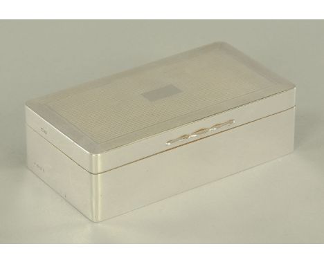 A silver engine turned table cigarette box, with Greek key decoration, Birmingham 1926, maker Charles S Green &amp; Co. Ltd.