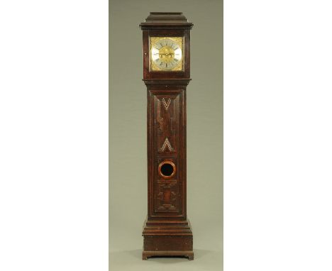 An oak longcase clock, with two-train striking movement by John Taylor, the dial 12" square, the case with glazed door and pa
