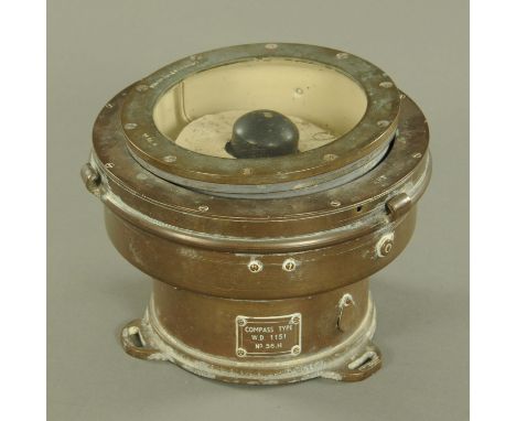 A World War II brass mounted naval compass, type WD1151 No 56.H.  Overall diameter 19 cm.