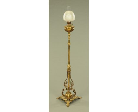 A 19th century brass lamp standard, with reservoir and etched shade.   CONDITION REPORT: The shade is in generally good condi