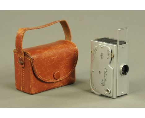 A Mamiya - 16 miniature camera, circa 1945-1952, in original leather carry case, the camera 6.5 cm wide.