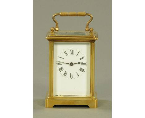 A French brass cased carriage clock timepiece, early 20th century, the enamel dial with Roman numerals, height excluding hand