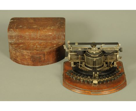 An American Hammond Multiplex vintage typewriter, housed in an oak case.  Case width 37 cm (see illustration). 
