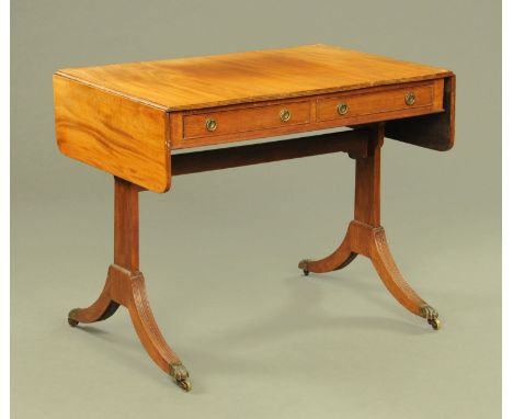 A 19th century mahogany sofa table, twin drop flap with two frieze drawers with brass drop handles with circular backplates a