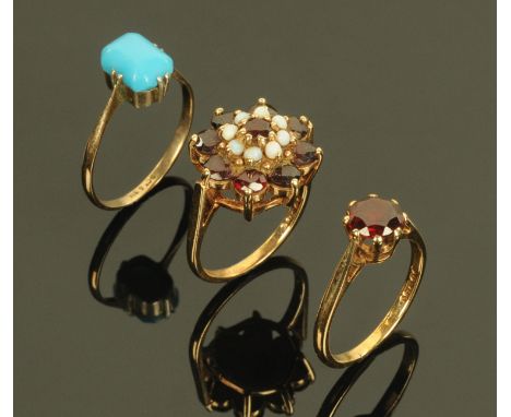 Three dress rings, 9 ct opal and garnet, 9 ct garnet and 9 ct and silver turqoise.