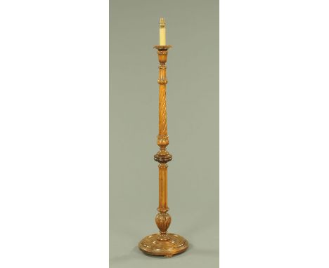 A lamp standard, with turned and carved column and circular base.  