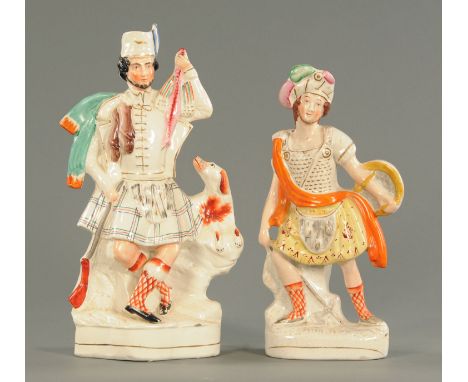 A pair of Staffordshire pottery figure, Rob Roy, mid 19th century, modelled standing holding a shield and axe, lettering in r