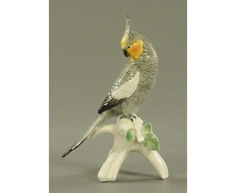 A Karl Ens porcelain model of a Teal, 20th century, modelled standing upon a leafy branch, factory printed marks.  23 cm high