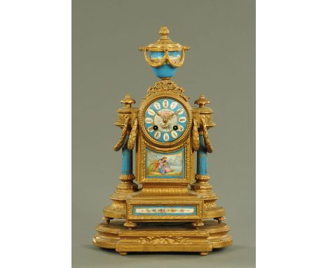 A French gilt spelter and Paris porcelain mantle clock, the porcelain decorated with cherubs, pastoral scene and floral bouqu