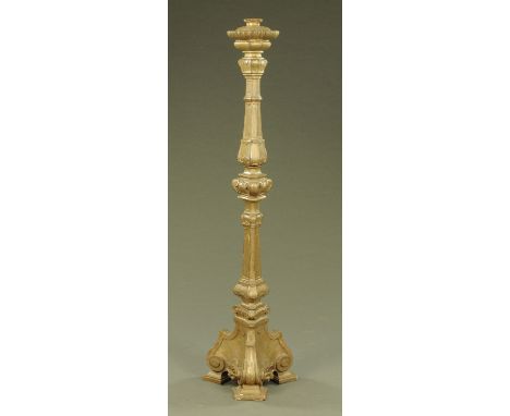 A large Venetian gilt painted wooden lamp standard, of scrolling and faceted form, raised on three legs with block feet.  Hei