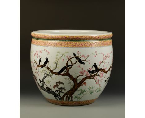 A LARGE CHINESE FAMILLE ROSE FISH BOWL decorated with magpies amongst prunus and lingzhi beneath an archaic scroll band, 21" 