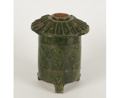 A CHINESE GREEN GLAZED MODEL OF A GRANARY, Han Dyn, with tiled roof over two dragons delineated by raised lines, with tripod 