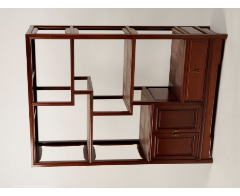 A CHINESE HUALI DISPLAY SHELF, the rectangular top with a central "floating" panel above asymetric shelves with moulded front