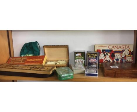 SHELF OF VARIOUS GAMES INCL; BOXED DOMINO SET, PLAYING CARDS, CRIB BOARDS