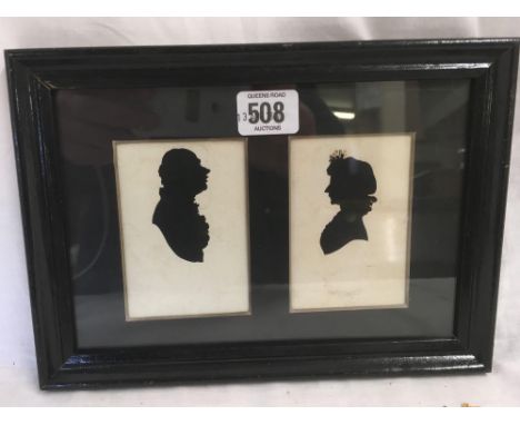 A PAIR OF ANTIQUE SCISSOR CUT PORTRAIT SILHOUETTES OF A LADY AND GENTLEMAN IN ONE FRAME.