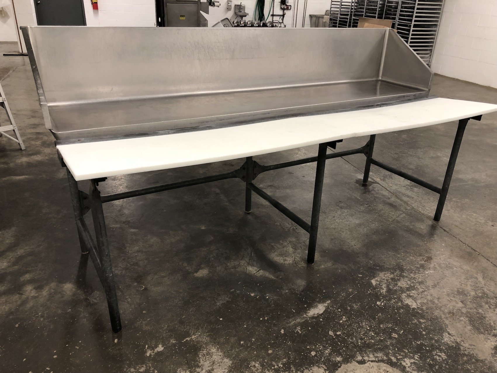S/S Butcher table with stainless steel back panel and plastic butcher
