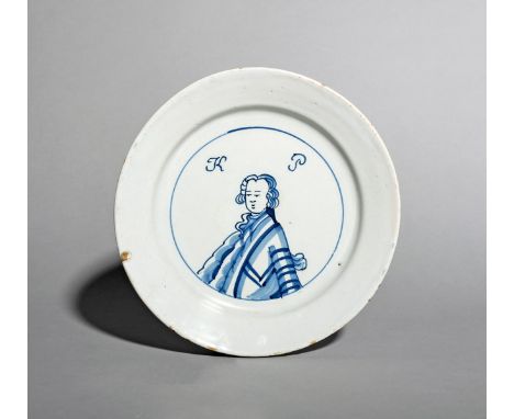 A good and rare English delftware King of Prussia plate, c.1757-60, painted in blue with a head and shoulders portrait of Fre