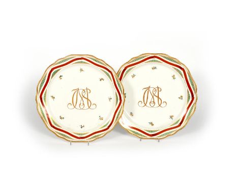 A pair of Vienna chargers, 2nd half 18th century, the wells bearing the monogrammed initials CSM in gilt and red, with sparse