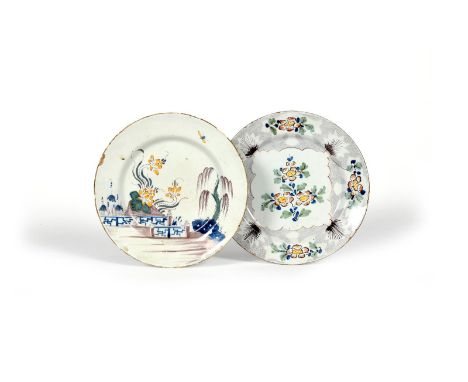 Two delftware plates, mid 18th century, one probably Wincanton and painted with a polychrome flower spray within a woolpack p