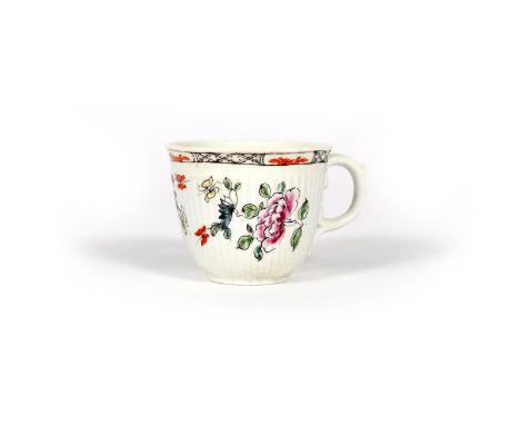 An early Worcester reeded coffee cup, c.1753-55, the rounded form moulded with a band of narrow vertical ribbing, painted wit