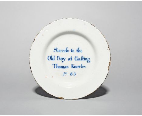 A documentary delftware plate, dated 1763, possibly Liverpool, the well inscribed in blue with 'Success to the Old Boy at Gas