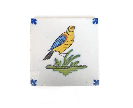 A Liverpool delftware bird tile, c.1750-75, painted with a large finch-like bird painted in yellow, blue, ochre and manganese