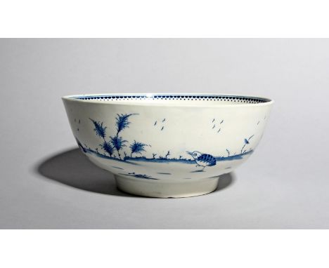 A rare Worcester blue and white punch bowl, c.1775, painted with a variation of the Two Quail pattern, with three birds strut