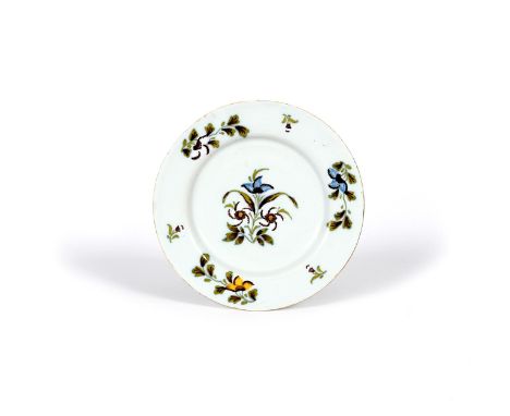 An Irish delftware plate, c.1760, probably Dublin, painted with flower sprays in shades of yellow, blue, green and manganese,