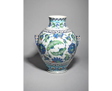 A large Cantagalli Iznik-style two-handled vase, late 19th century, the baluster body painted in typical shades of blue, red,