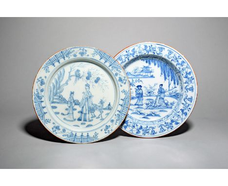 Two delftware chargers, c.1750-70, painted in blue with chinoiserie scenes, with figures and attendants in garden settings be