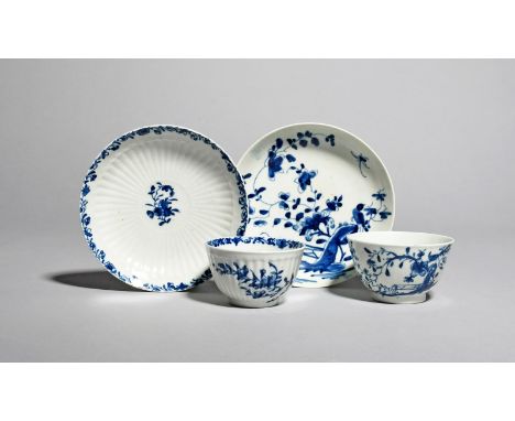 Two Worcester blue and white teabowls and saucers, c.1754-58, one painted with the Rock Warbler pattern, crescent mark, the o