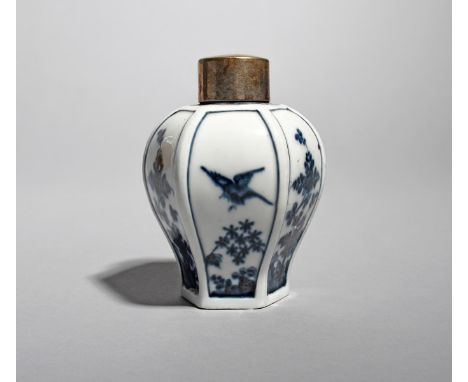 A Meissen hexagonal tea canister and cover, c.1725-28, the baluster body painted in underglaze blue with alternating panels o