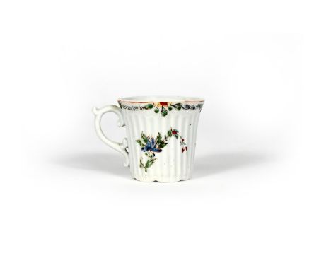An early Worcester reeded coffee cup, c.1753-54, the slightly flared form moulded with a band of reeding over seven lobes, pa