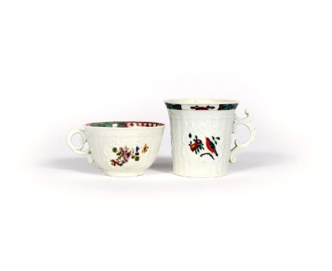 An early Worcester coffee cup and a teacup, c.1754, painted in the Oriental manner, the coffee cup with two panels of a colou