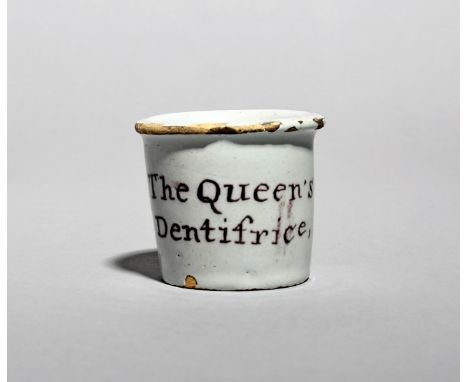 A rare English delftware ointment pot, c.1775, of small cylindrical form with an everted rim, painted in manganese with 'The 