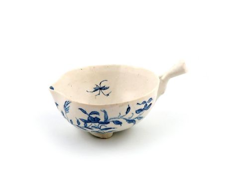 An English porcelain blue and white cup or wine taster, c.1755 or later, of peach shape, painted with a loose leaf spray, a s