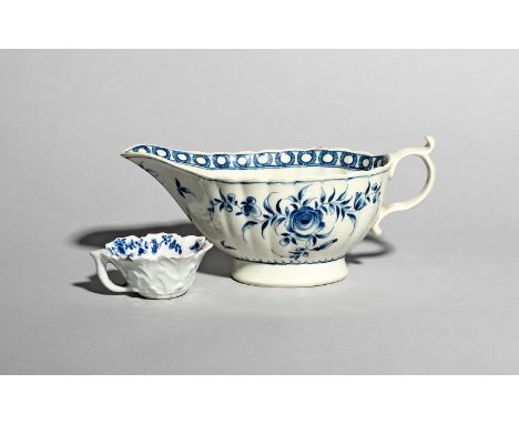 A large Worcester blue and white sauceboat and a butterboat, c.1760-75, the sauceboat of generous fluted form and painted wit