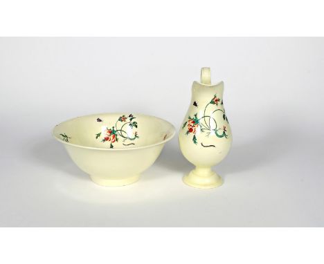 A creamware ewer and basin, late 18th/19th century, painted with insects around scattered flower sprays, the footed ewer with