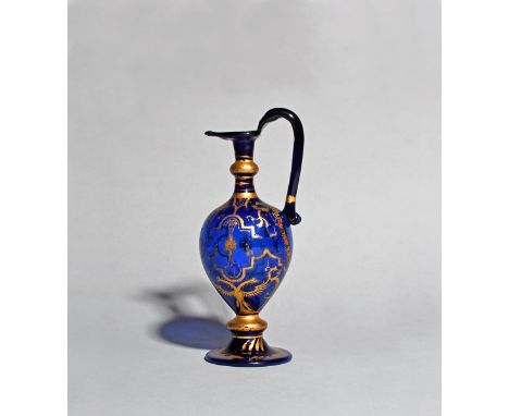 A very rare façon de Venise carafe or ewer for the Austrian market, c.1560-90, Italian, the body of a rich blue glass, with c