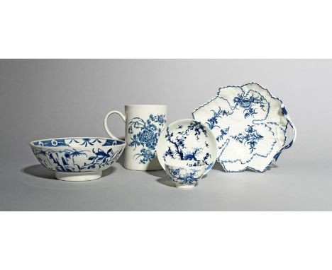 A Worcester blue and white teabowl and saucer, c.1755-60, painted in the Prunus Root pattern, a tall Worcester mug printed wi