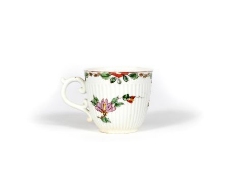 An early Worcester reeded coffee cup, c.1753-55, the rounded form moulded with a band of narrow vertical ribbing, painted wit