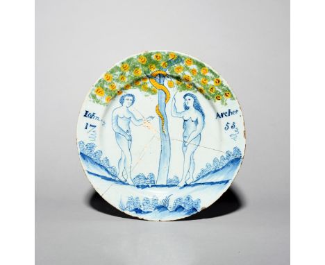 A rare Bristol delftware documentary Adam and Eve charger, dated 1755, the first couple depicted flanking the Tree of Knowled