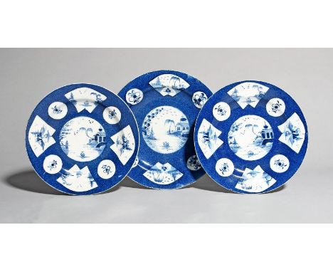 Three Bow blue and white plates, c.1760-65, all with fan panel decoration of a central circular vignette of a Chinese landsca