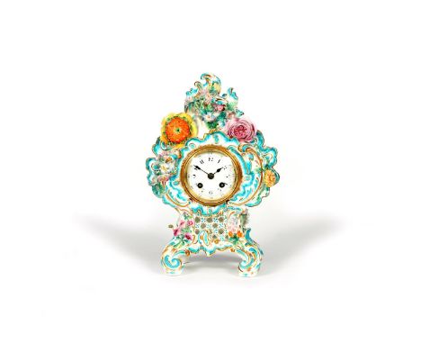 A Coalport cased clock, c.1840-50, of elaborate rococo scrolled form, applied with colourful flowers and highlighted in turqu